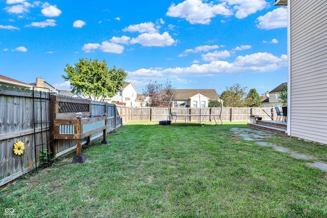 view of yard featuring a storage unit