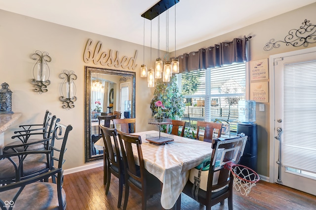 dining space featuring dark hardwood / wood-style floors