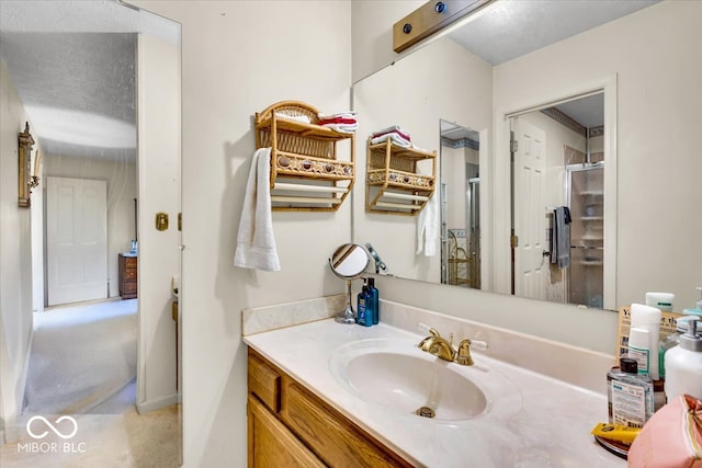 bathroom with vanity and walk in shower