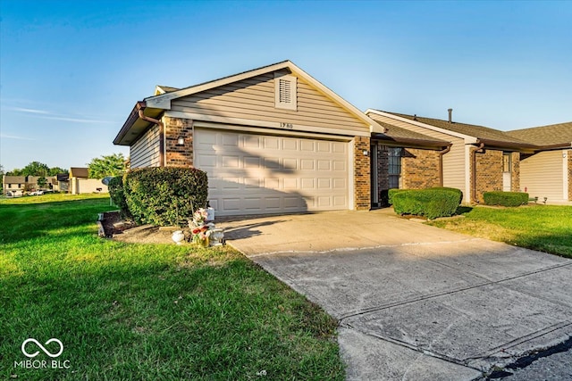 ranch-style home featuring a garage and a front lawn