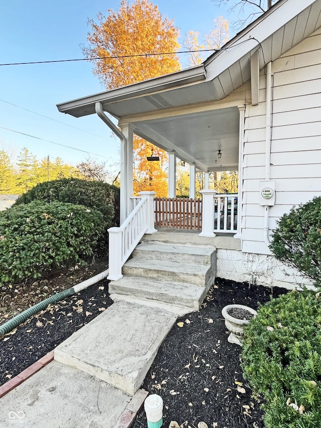 property entrance with covered porch