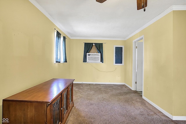 carpeted spare room with ceiling fan, electric panel, ornamental molding, cooling unit, and a textured ceiling