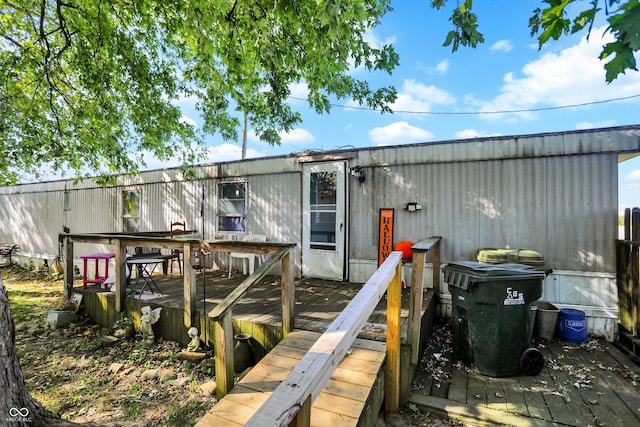 rear view of property with a deck