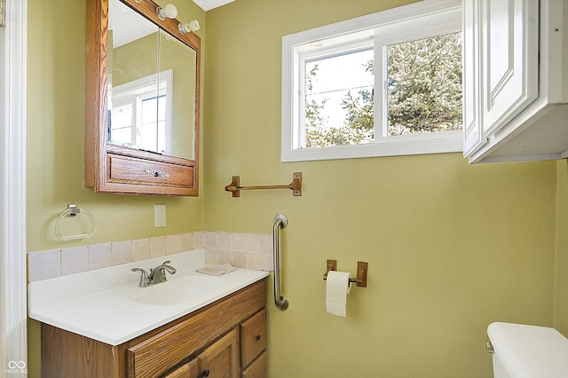 bathroom with vanity and toilet