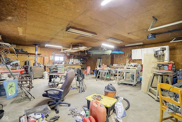 garage featuring a workshop area and a garage door opener