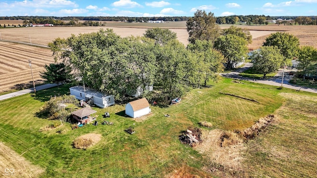 birds eye view of property featuring a rural view