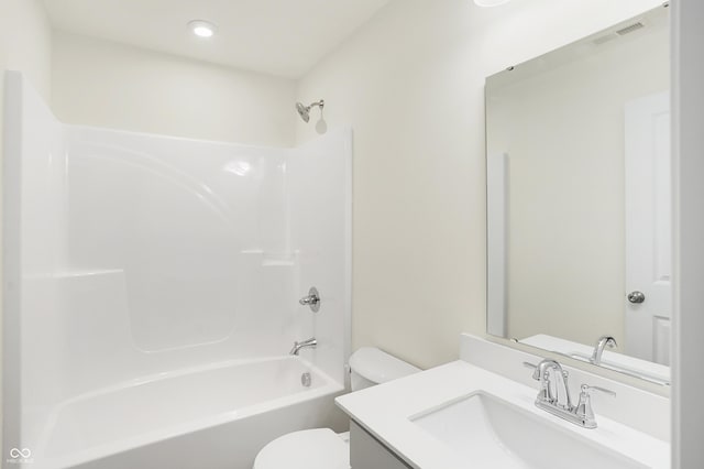 full bathroom featuring vanity, toilet, and washtub / shower combination