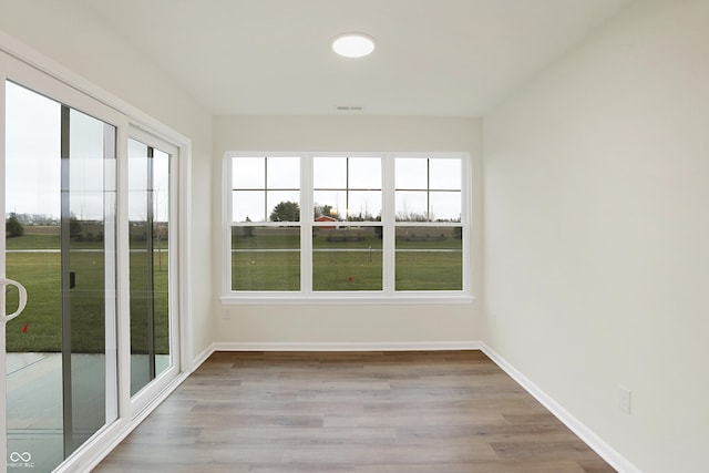 unfurnished sunroom with plenty of natural light