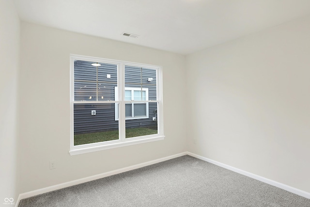 spare room featuring carpet flooring