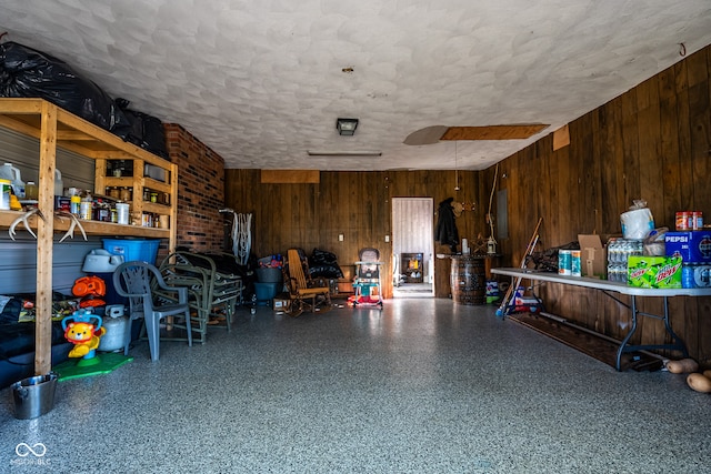 garage featuring wood walls