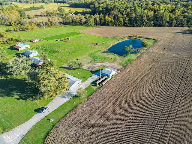 birds eye view of property with a water view and a rural view