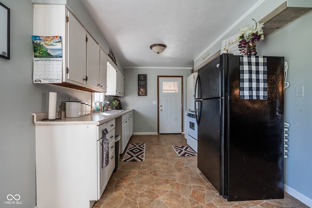 kitchen featuring white cabinets, sink, black fridge, white range oven, and ornamental molding