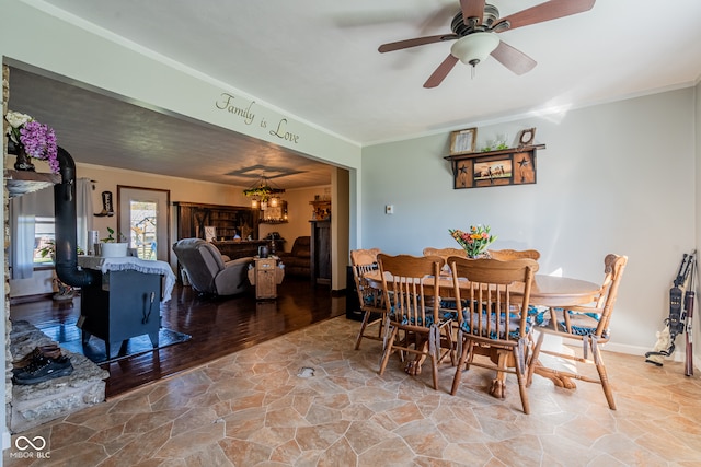 dining area featuring ornamental molding, ceiling fan, and wood-type flooring