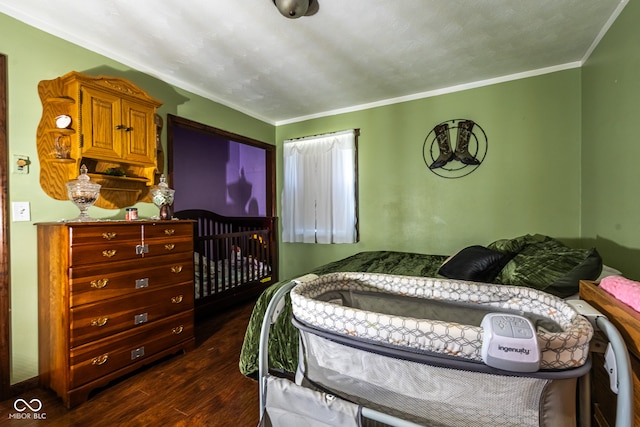 bedroom featuring dark hardwood / wood-style floors and ornamental molding