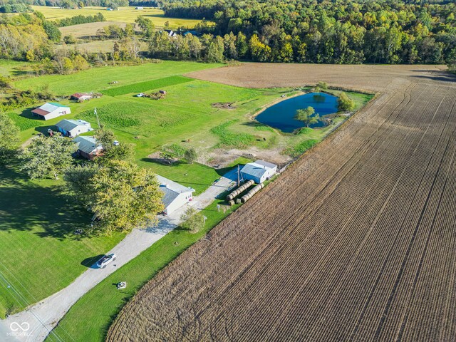 bird's eye view featuring a water view and a rural view