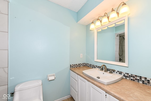 bathroom featuring vanity, a textured ceiling, toilet, and backsplash