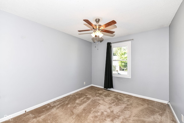 unfurnished room with a textured ceiling, carpet flooring, and ceiling fan