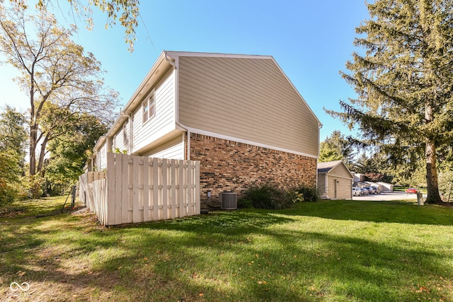 view of side of home featuring a yard