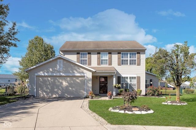 view of front of house with a front yard and a garage