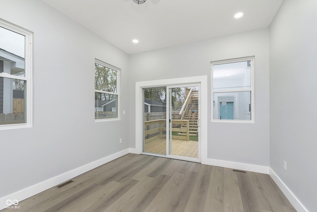 unfurnished room with light hardwood / wood-style flooring