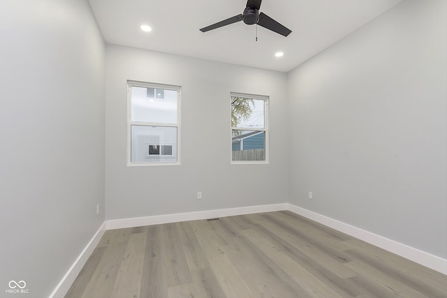 empty room featuring ceiling fan and light wood-type flooring