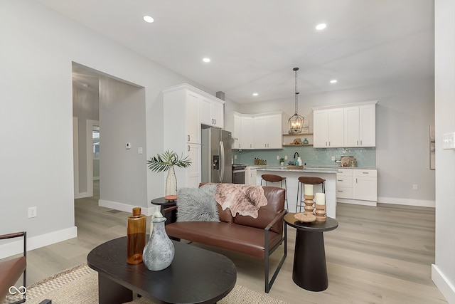 living room with light hardwood / wood-style flooring