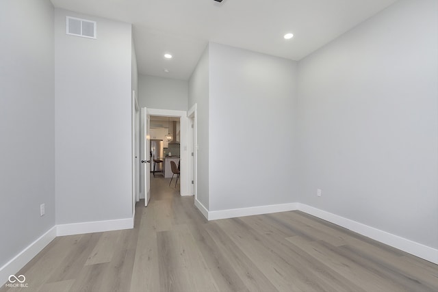 hall with light hardwood / wood-style flooring