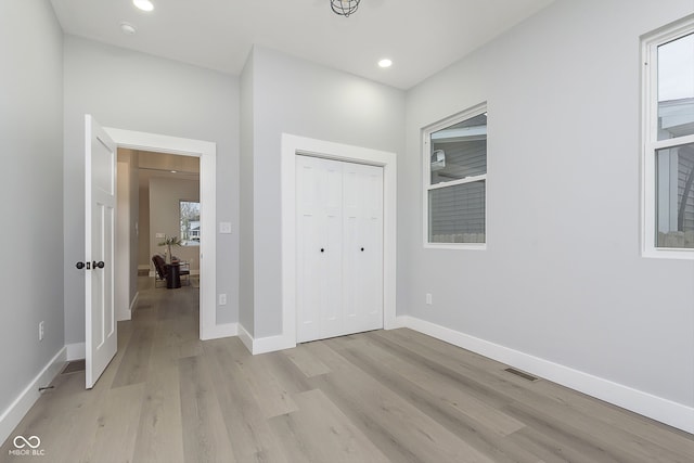 interior space featuring a wealth of natural light and light hardwood / wood-style flooring