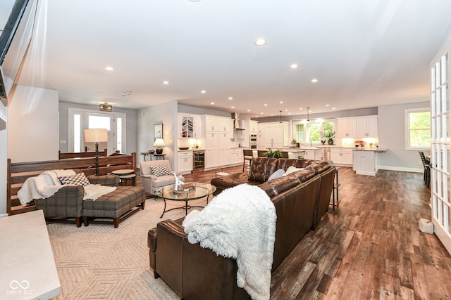 living room featuring hardwood / wood-style flooring and beverage cooler