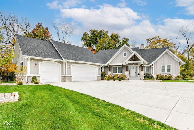 view of front of house featuring a front yard and a garage