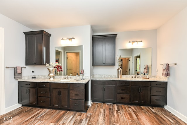 bathroom with vanity and hardwood / wood-style flooring