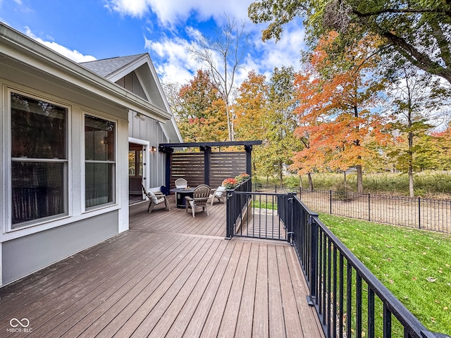 wooden terrace with a lawn