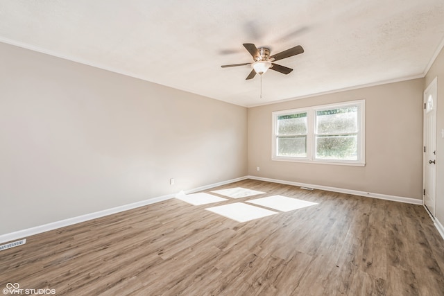 unfurnished room with crown molding, ceiling fan, and hardwood / wood-style floors