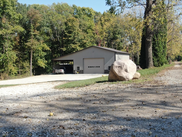 garage featuring a carport