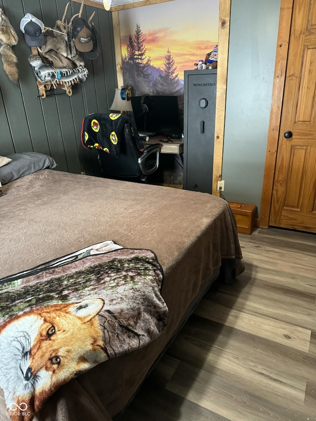 bedroom with wood-type flooring