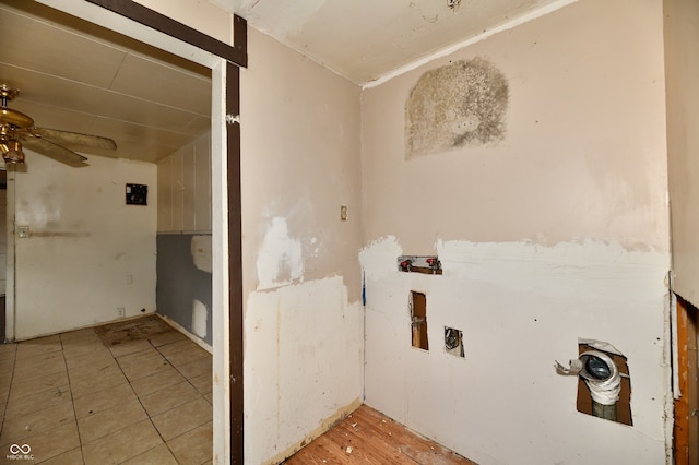 clothes washing area featuring ceiling fan