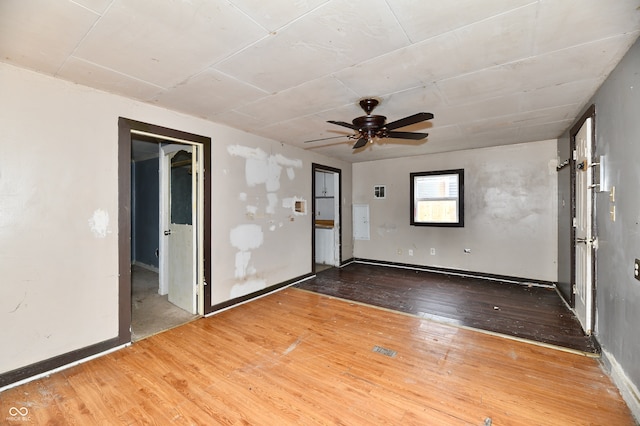 unfurnished room featuring ceiling fan and hardwood / wood-style floors