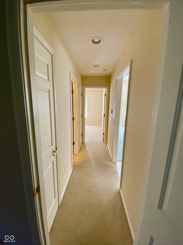 hallway with light carpet