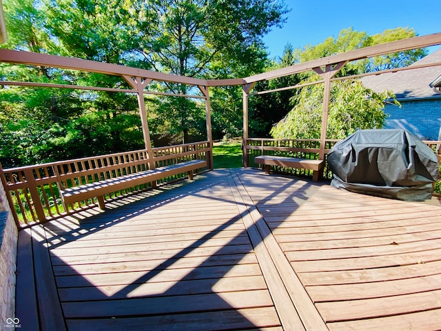 wooden deck featuring grilling area