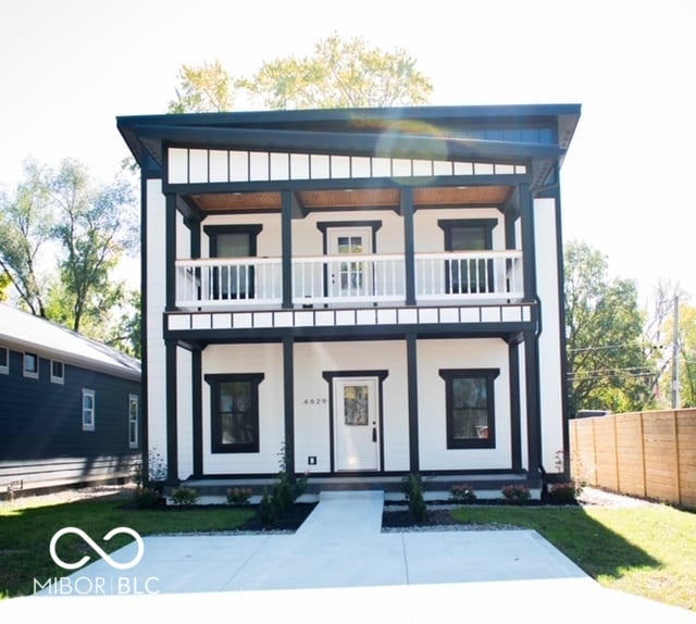 view of front of property with a balcony