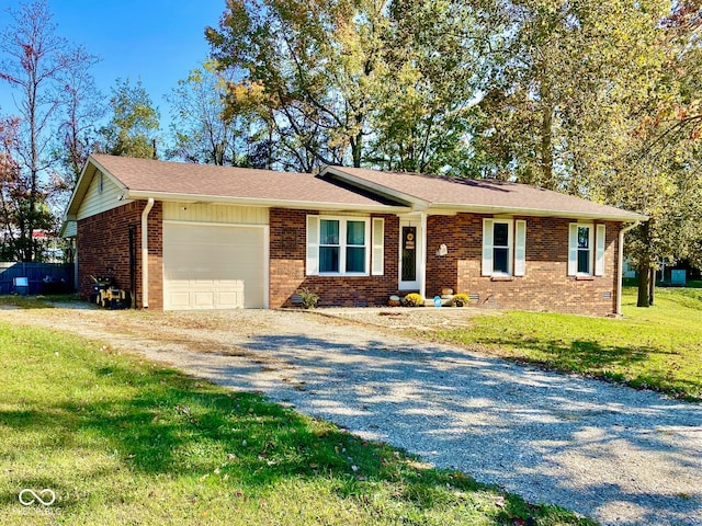 ranch-style home with a garage and a front yard