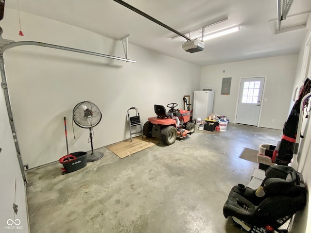 garage with electric panel and a garage door opener