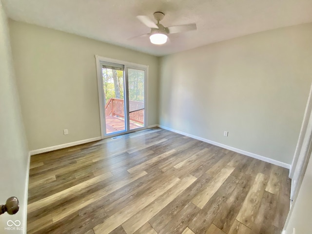 spare room featuring ceiling fan and light wood-type flooring