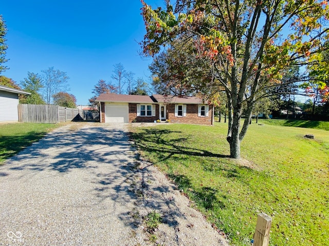 ranch-style house with a front yard and a garage