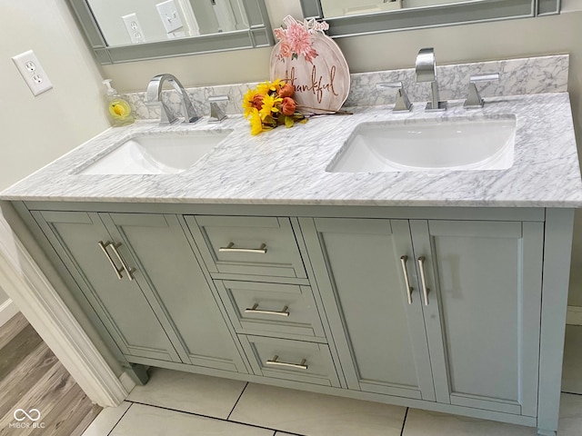 bathroom featuring tile patterned flooring and vanity