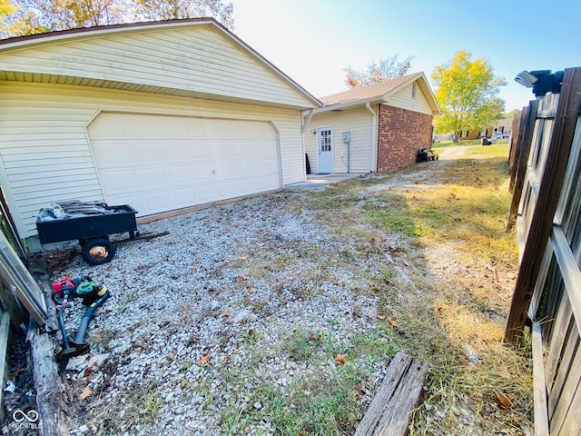 view of side of home with a garage