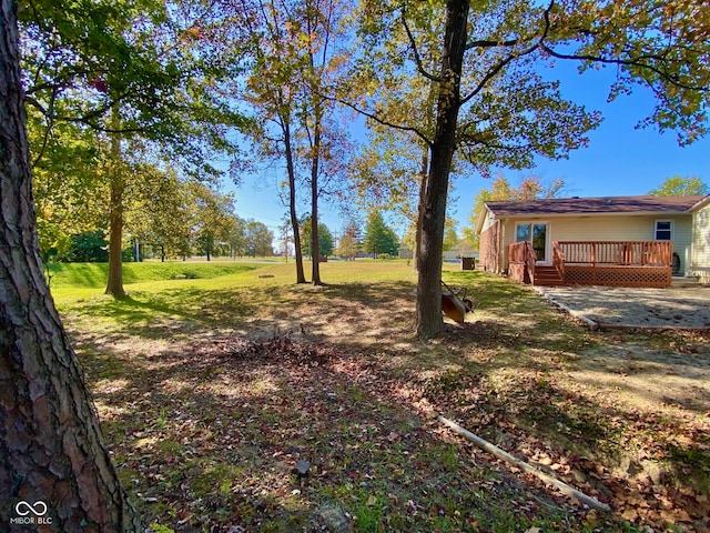 view of yard featuring a deck