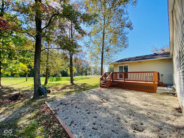 view of yard featuring a wooden deck