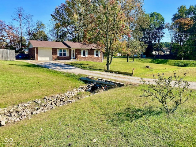 view of front of property featuring a front yard and a garage