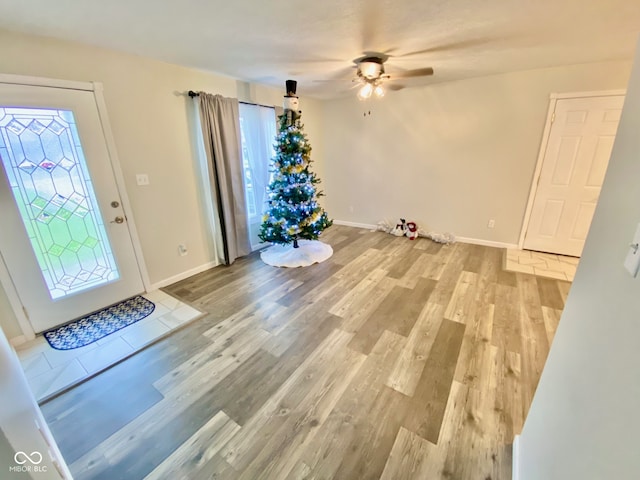 entryway featuring light hardwood / wood-style flooring, a wealth of natural light, and ceiling fan